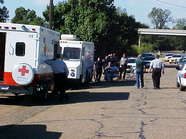 Police personnel waiting for instruction.
